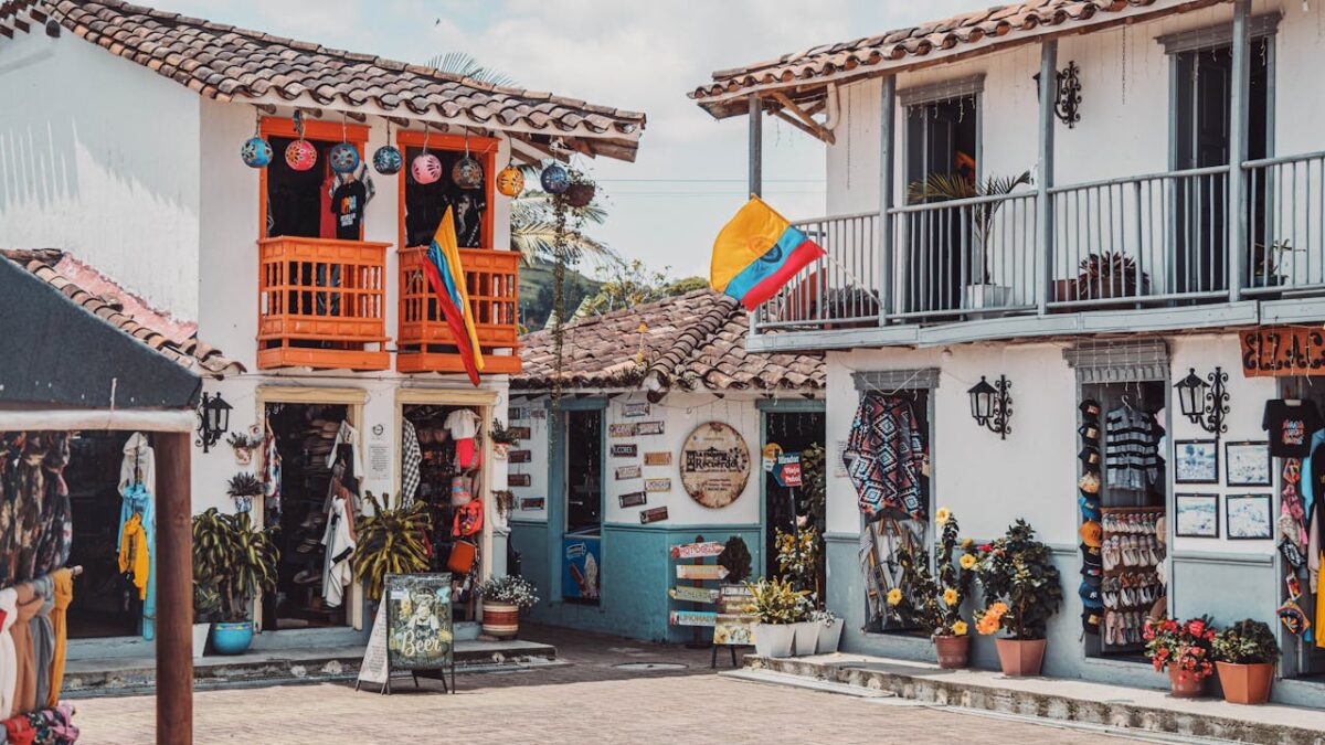 Charming Colombian street with vibrant shops and decorations.
